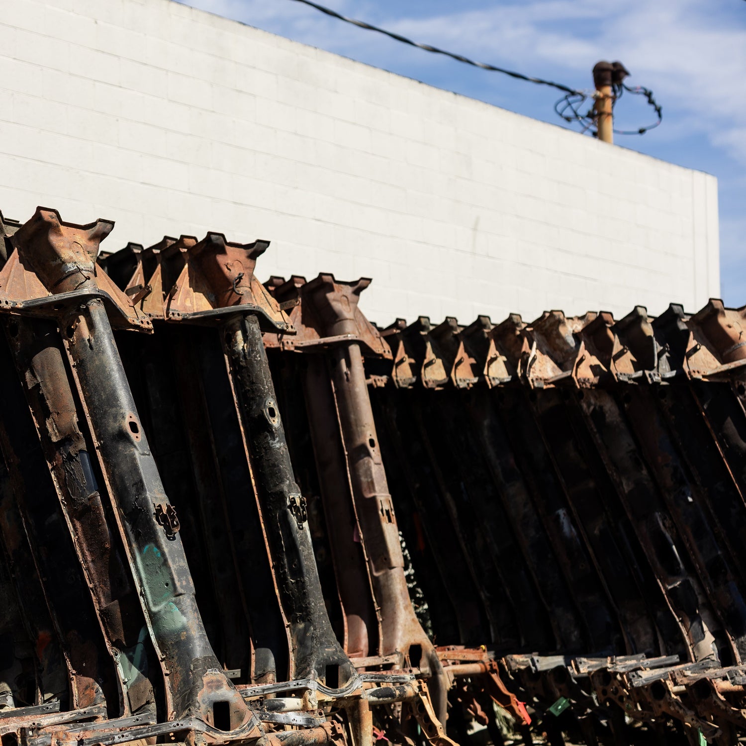 Row of air-cooled VW chassis at Washburn's Metal, Orange CA