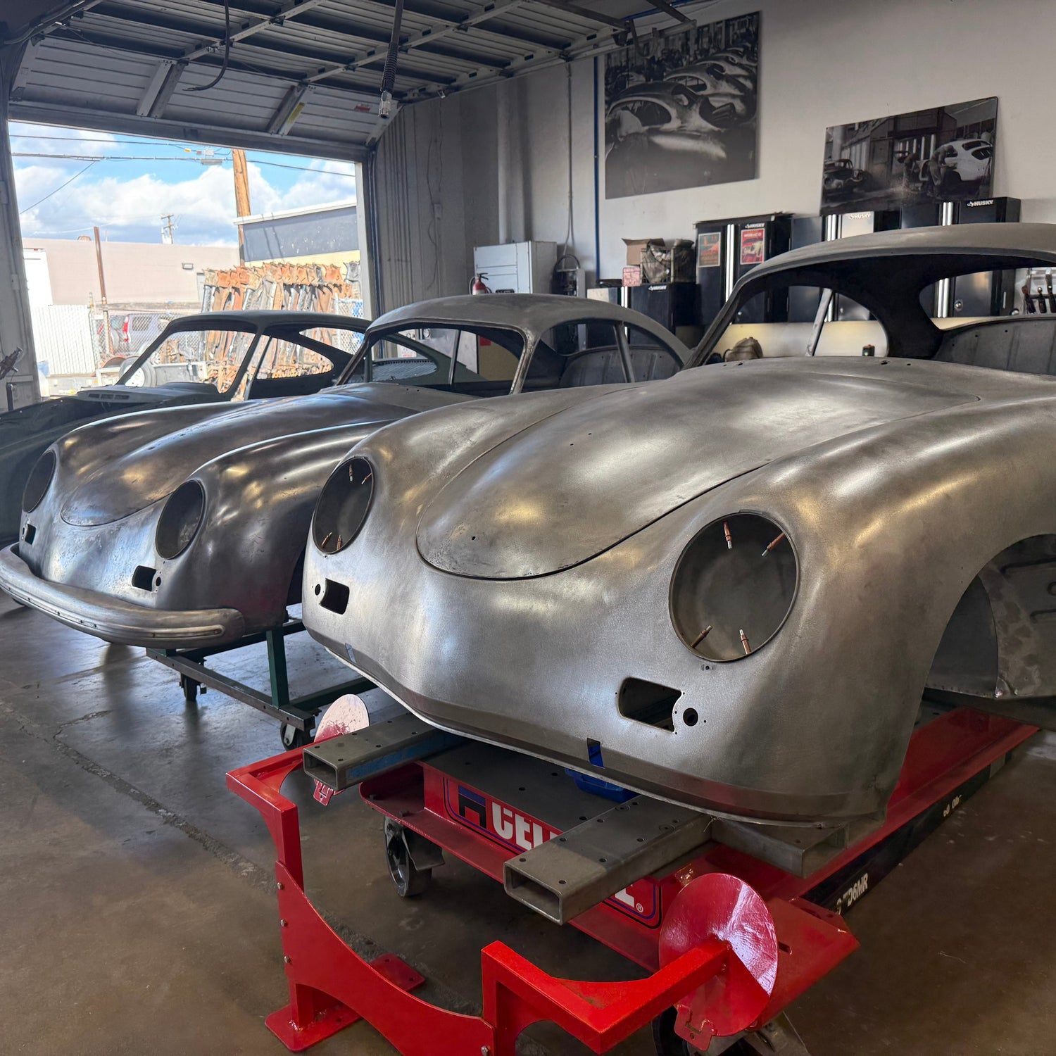 Blue VW Karmann Ghia in the build bay at Washburn's Metal, Orange CA