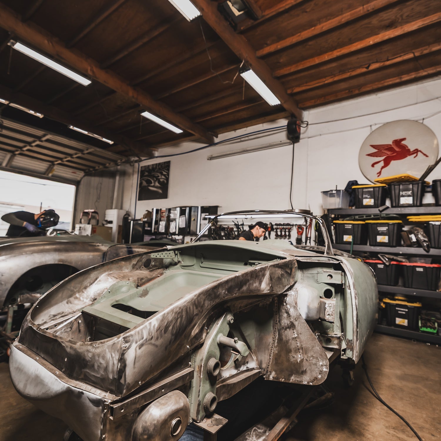 Three Porsche 356 bodies under restoration at Washburn's Metal, Orange CA